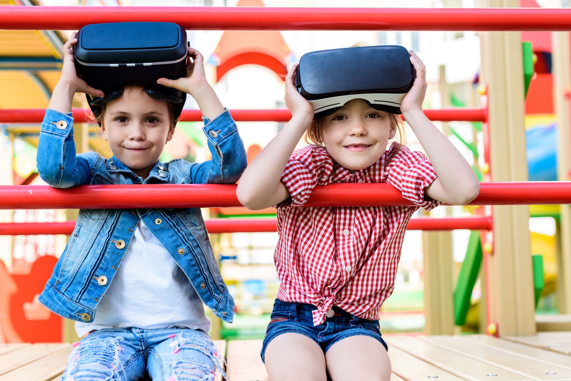 Children in park wearing VR headsets